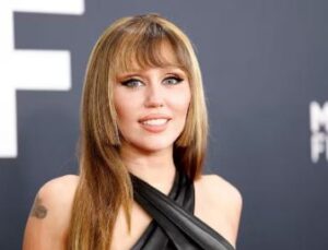 Miley Cyrus dazzles in bold blazer look at Maybelline launch