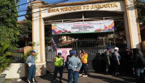 Multiple explosions shake a mosque in an Indonesian high school and injure 55
