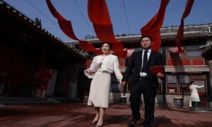 In China, wedding bells are ringing in nightclubs, a subway station and on snowy mountain peaks