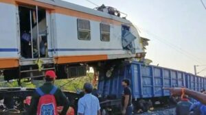 Passenger train collides with cargo train in central India, killing at least 11