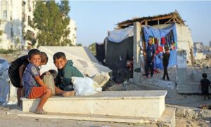 In Gaza cemeteries, displaced Palestinians live among the dead