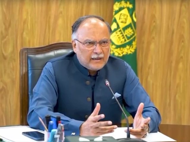 Federal Minister Ahsan Iqbal addresses Pakistan Day ceremony, calling for economic revival and self-reliance as the nation faces fuel and pollution crises