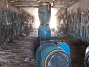 Security forces examine improvised explosive devices discovered beneath a bridge on the Quetta-Karachi highway in Balochistan's Surab district