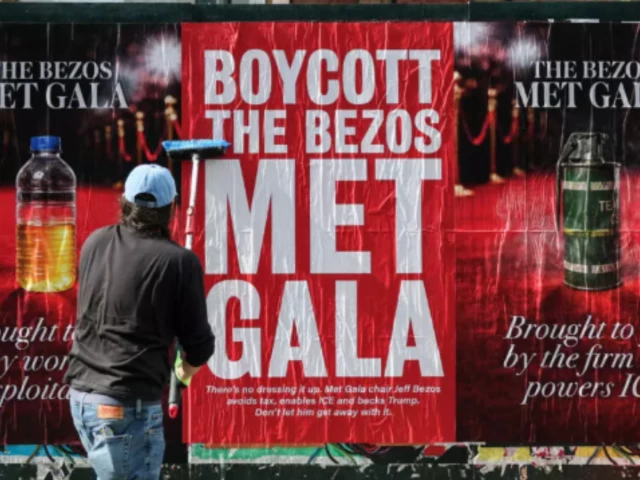 Anti-Bezos poster on New York subway calling for Met Gala boycott, referencing Amazon driver conditions and ICE contract.