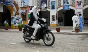 Workers assemble electric motorcycles in Hyderabad as soaring petrol prices and fuel shortage fears drive record sales in Pakistan