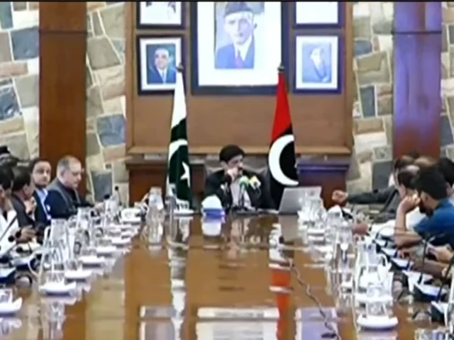 Sindh Chief Minister Murad Ali Shah demonstrates registration process for People's Motorcycle Fuel Subsidy Programme in Karachi.