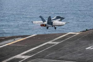 US-Israeli strike targets dock in Bandar Lengeh, setting two commercial vessels on fire and injuring one person as conflict expands to commercial shipping.