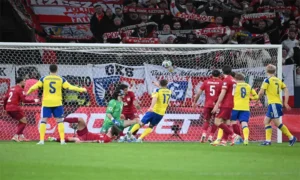 Italian players react after losing to Bosnia on penalties, marking Italy's third consecutive World Cup qualification failure.