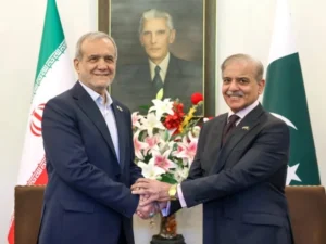 Prime Minister Shehbaz Sharif and Iranian President Masoud Pezeshkian discussing regional peace and Iran-US negotiations.