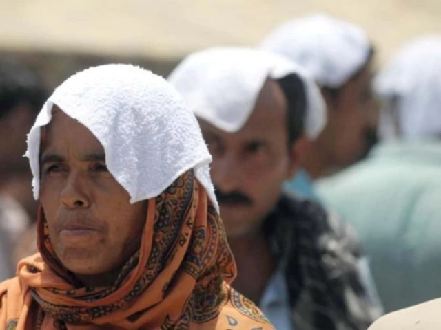 Karachi residents seek shade as city records hottest day of season at 40.9°C with heat index reaching 45°C due to breakdown of sea breezes.