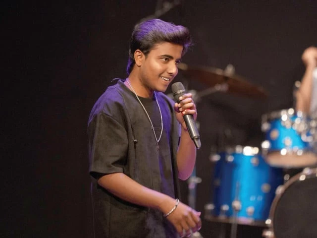 Musicians performing at NAPA’s Zia Mohyeddin Theatre during the Karachi Repertory Festival featuring fusion, jazz, and semi-classical music.
