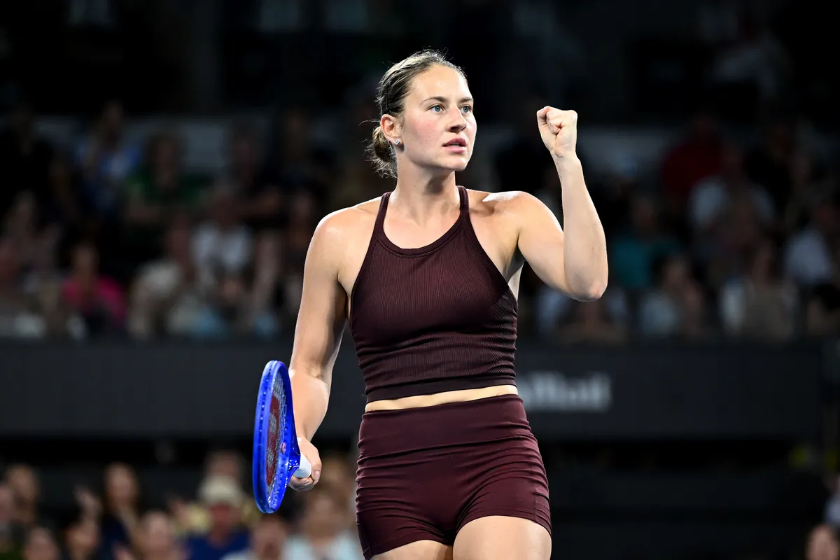 Marta Kostyuk celebrates with Madrid Open trophy after defeating Mirra