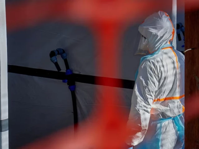 Health workers in protective equipment responding to an Ebola outbreak in Central Africa.