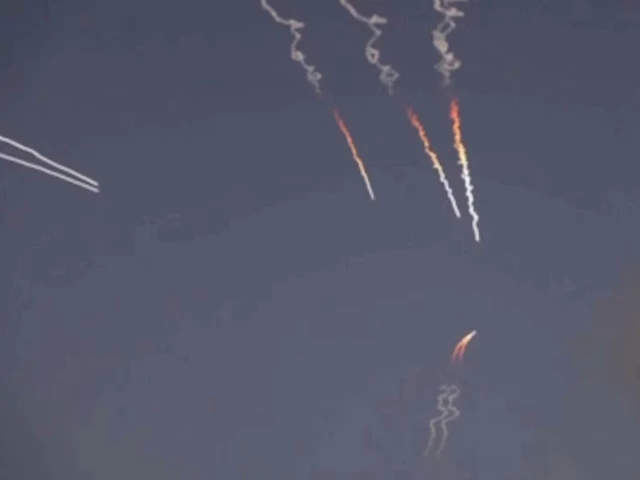 Missile launches and military activity near the Strait of Hormuz amid escalating tensions between Iran and the United States.