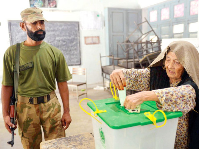 Voters casting ballots at a polling station during the Gilgit-Baltistan Legislative Assembly elections 2026.
